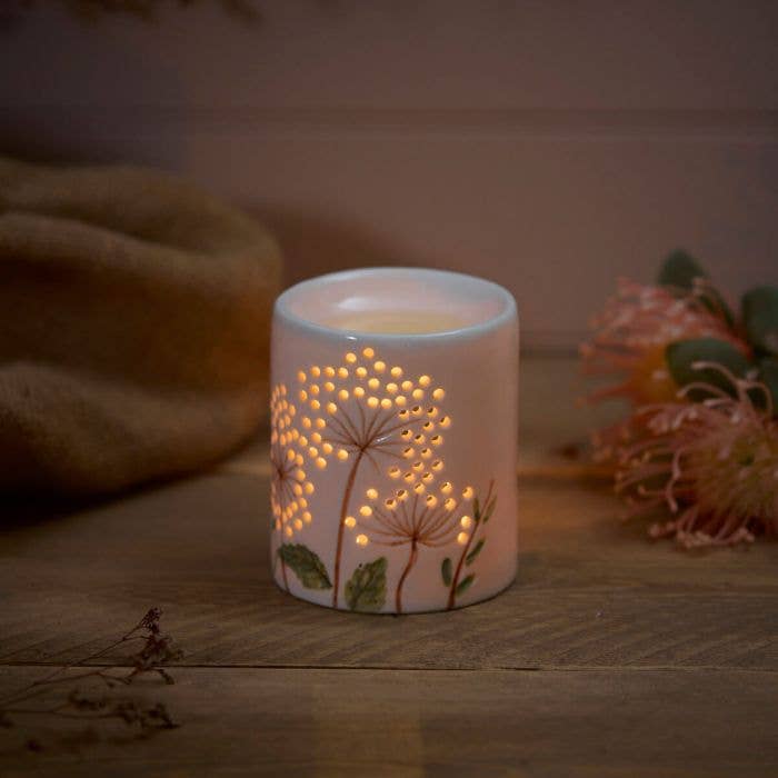 Brûleur de cire en céramique avec détail de fleur découpée