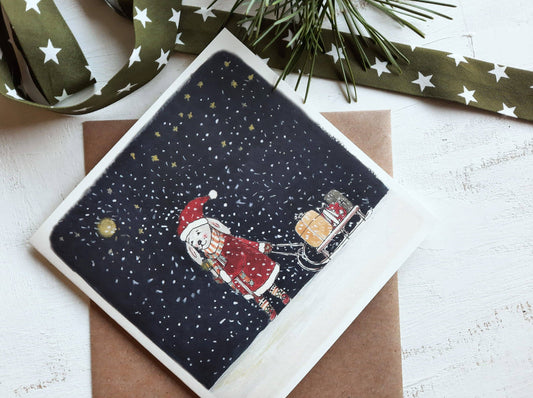 Carte illustrée 7×10 cm représentant un lapin sous une nuit d’hiver, impression aquarelle.